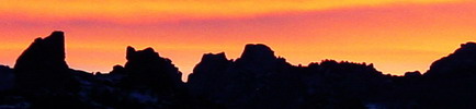Golden orange sunset over granite peaks known as Devil's Bedstead